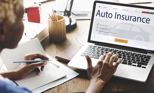 Woman purchasing auto insurance online.