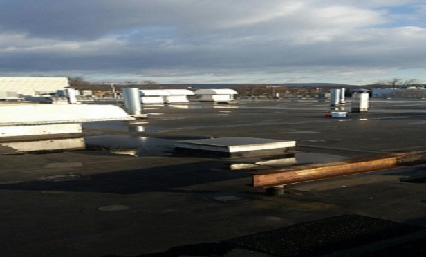 Water ponding on a roof.