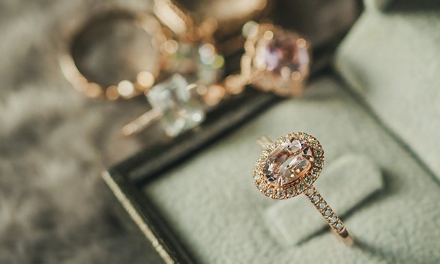 Close up of a large ring with a single jewel.