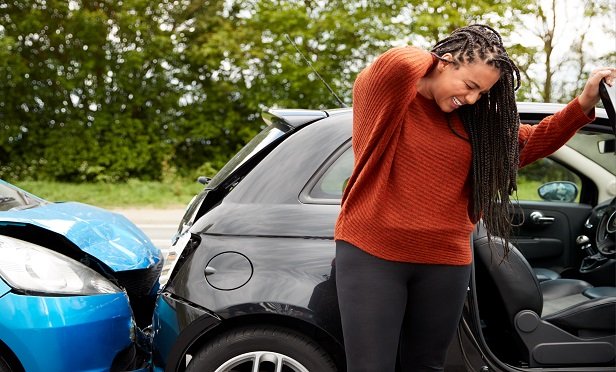 Female motorist with whiplash injury.