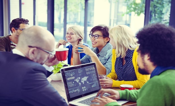 Gen Z workers around a table.