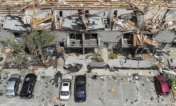 <b>Apartment owners</b> are feeling outsized impact from umbrella insurance market turbulence, with <b>rates growing triple digits</b> in some instances. (AP Photo/John Minchillo) 