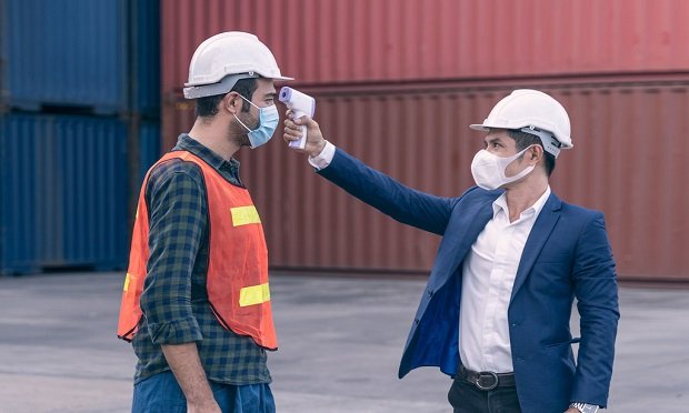 Are workers who contract COVID-19 on the job eligible for worker's compensation? (Photo: Shutterstock)
