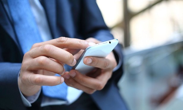Man receiving a payment on his phone.