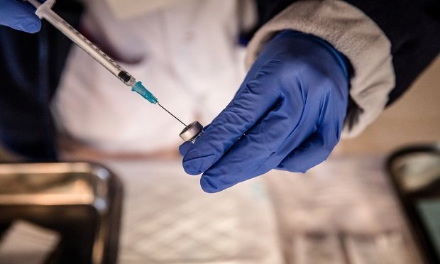 A nurse prepares to draw a dose of the Pfizer-BioNTech COVID-19 vaccine from a vial at the Atzavara nursing home in Catalunya, Spain, on Tuesday, Dec. 29, 2020. (Photo: Bloomberg)