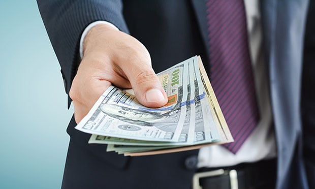 Man holding money in his hand.