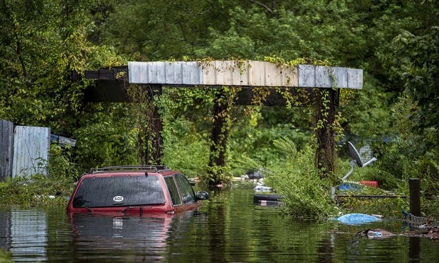 Private flood insurance often provides better coverage at a lower price when compared to the National Flood Insurance Program (NFIP), but this is especially true for homeowners with lower incomes. Here, A vehicle sits submerged in flood water following Tropical Storm Imelda in Fannett, Texas, U.S., on Fri., Sept. 20, 2019. (Sergio Flores/Bloomberg)