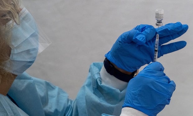 Until the United States reaches herd immunity from COVID-19, church staff, volunteers and members are still at risk of spreading the disease. Here, a pharmacist fills a dead volume syringe with the Pfizer-BioNTech COVID-19 Vaccine at a pop-up vaccination site at St. Luke's Episcopal Church in the Bronx borough of New York. (Photo: Mary Altaffer/AP)