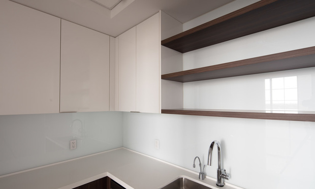 The supports of the kitchen cabinets in a home were water damaged from a loss that occurred before a person had purchased a home. (Photo: Rodolfo Benitez)