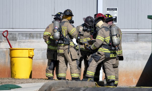 Hall County, Ga., first responders were called on to the scene after reports of burns at the poultry processing plant, The Gainesville (Ga.) Times reported. Dying at the scene immediately were three maintenance workers and two other employees. A sixth worker died on the way to the hospital. (Credit: Scott Rogers/The Gainesville Times) 