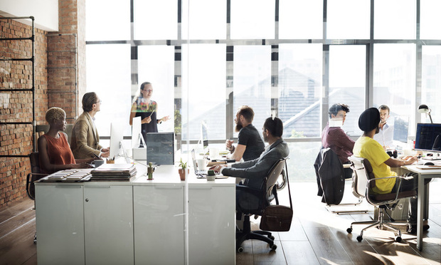 Recent college graduates are more likely than other groups to get lost in the shuffle of returning to an environment of more spontaneous communication on-site and perceive less of a collaborative and more of a gossipy feel on their team. (Credit: Rawpixel.com/Shutterstock) 