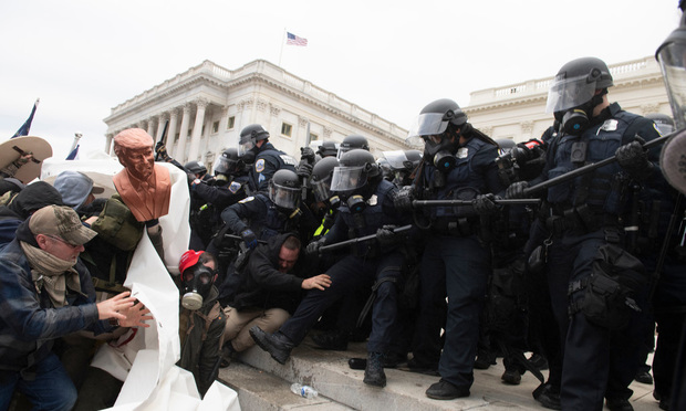 Rioters confront police at the U.S. Capitol on Jan. 6, 2021, in an attempt to prevent Congress from conducting the ceremonial counting of Electoral College votes. The disorderly mob left a trail of destruction throughout the Capitol Building. The riot left four dead, at least 14 police injured and resulted in more than 50 arrests. (Photo: Gallagher Photography/Shutterstock)