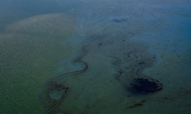 An oil patch floats in the waters of Talbert Marsh during an oil spill in Huntington Beach, California, U.S., on Sunday, Oct. 3, 2021. A 3,000-barrel oil spill off the coast of California has washed up on the beaches of Orange County and threatens to contaminate nearby wetlands. (Photo: Ariana Drehsler/Bloomberg)