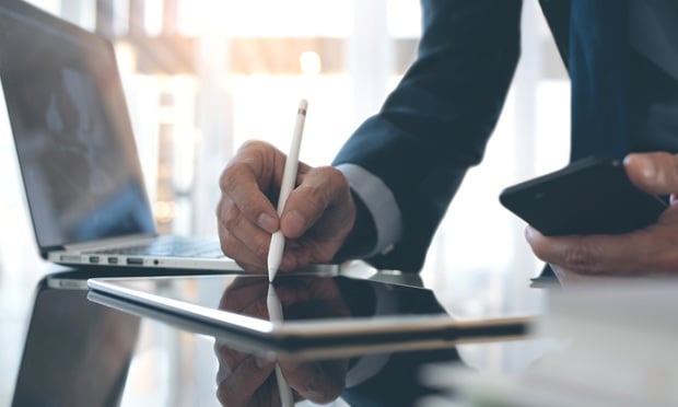 While signing, scanning and emailing a contract may seem like the fastest way to finalize an agreement, this method can leave insurance companies incredibly vulnerable to cyberattacks including data theft, extortion and malware installation. (Credit: TippaPatt/Shutterstock.com)