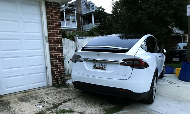 Tesla car charging outside a home in Baltimore, MD. Photo: Diego M. Radzinschi/ALM