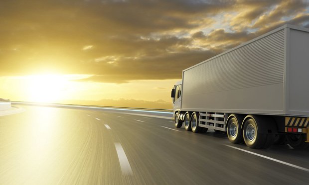 Semitruck driving down the road.