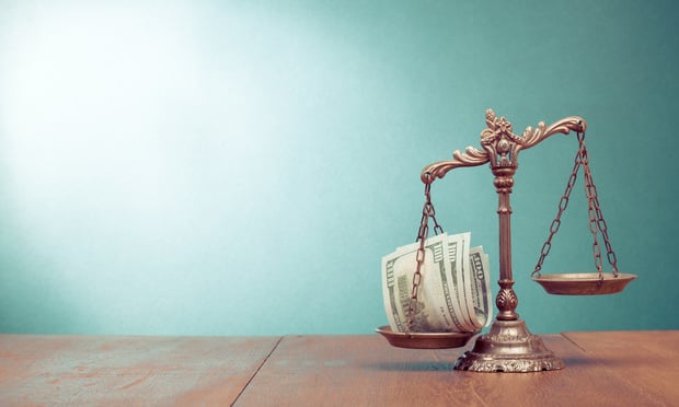 Scale holding a wad of money on one side, nothing on the other