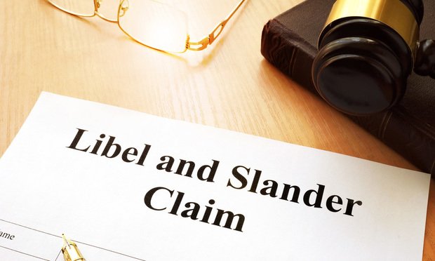 Libel and Slander Claims on desk.