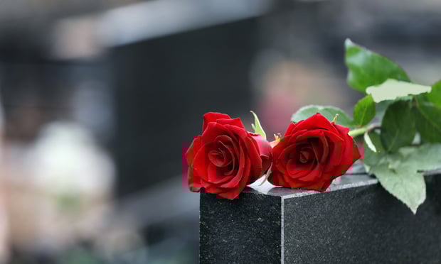 Gravestone with flowers. 