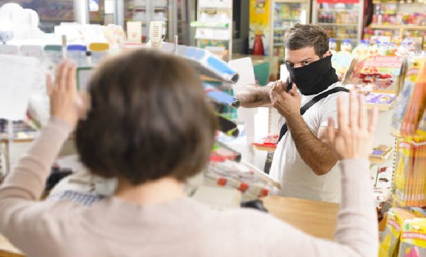 Man robbing a store.