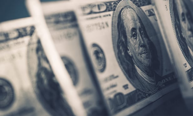 Close up of $100 bills.