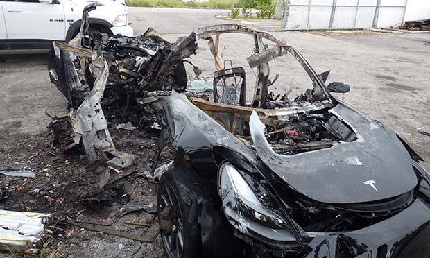 Barrett Riley had been driving at 116 mph on a curve with a posted speed limit of 25 mph on May 8, 2018. He lost control of his vehicle, a 2014 Model S, which collided with a concrete wall and burst into flames. A second passenger also died but a third passenger survived the fiery crash. (Photo: Tesla Model 3 crash, Miami-Dade County, Florida. Credit: National Transportation Safety Board)