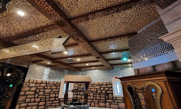 The ceiling in the Hall of Miracles at Give Kids the World village is covered in tiny brass stars.