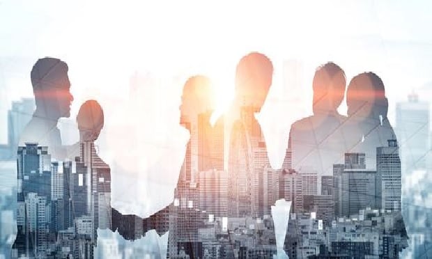 Images of business people superimposed over a city skyline.