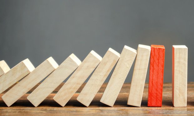 Wooden blocks and the effect of dominoes.