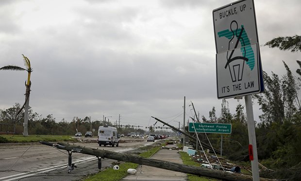 Broken utility poles lie on a street following Hurricane Ian in Fort Myers, Florida, US, on Thursday, Sept. 29, 2022. Hurricane Ian, one of the strongest hurricanes to hit the US, weakened to a tropical storm but continues to dump rain on the state as it makes its way up the US Southeast. Photographer: Eva Marie Uzcategui/Bloomberg