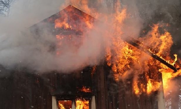 House on fire from a wildfire.