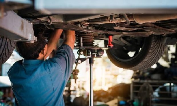 Mechanic repairing a car.