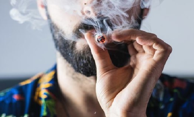 Man smoking cannabis.