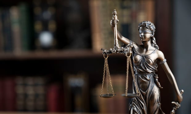 Themis statue on a lawyer's desk