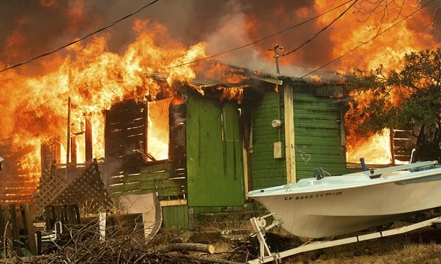 A residence burns as the Carr Fire tears through Shasta, Calif., on Thursday, July 26, 2018. (AP Photo/Noah Berger)