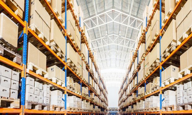 A warehouse with boxes on shelves.