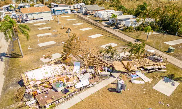 Aerial drone photo of mobile home trailer parks in Fort Myers FL which sustained damage from Hurricane Ian. Within a week after Hurricane Ian made landfall, policyholders were able to receive $5,000-$20,000 payments prior to an adjuster's inspection, according to FEMA. (Credit: Felix Mizioznikov/Adobe Stock) 