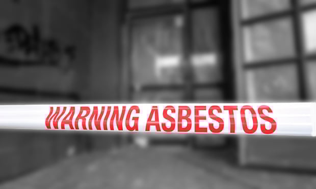 CHRISTCHURCH - DEC 04 2015:Sign reads: Warning - Asbestos removal in progress.Inhalation of asbestos fibers can cause serious and fatal illnesses including lung cancer, mesothelioma and asbestosis.