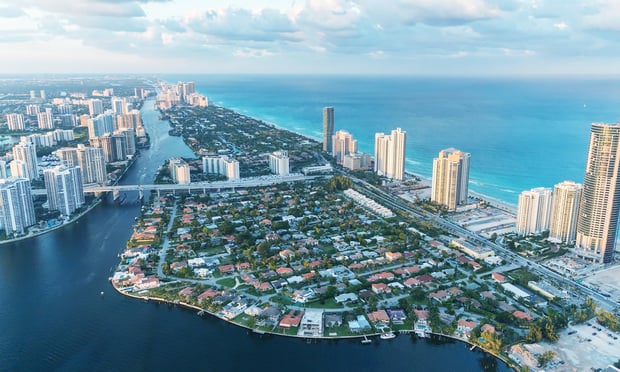 Sskyline of Miami at sunset. Credit: pisaphotography/Shutterstock.com
