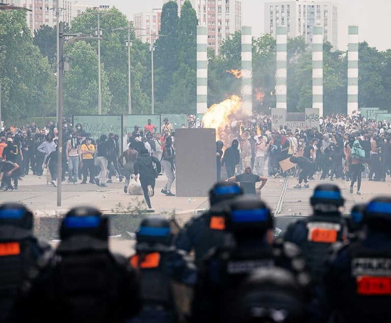 Demonstrators clash with police after a march protesting the shooting of Nahel, 17, by a police officer in the Nanterre suburb of Paris, France, on Thursday, June 29, 2023. Credit: Benjamin Girette/Bloomberg