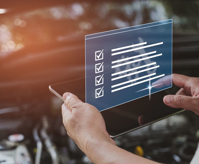 A person holds a digital checklist