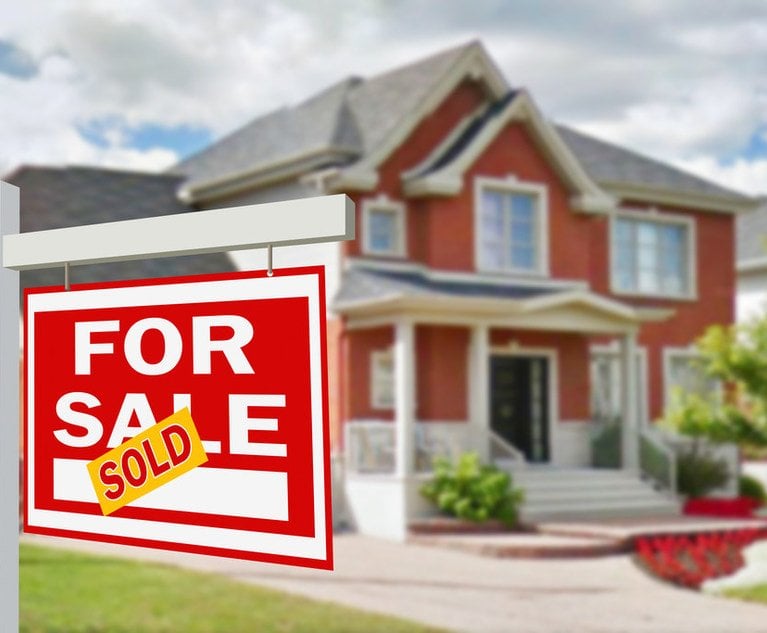 A 'For Sale' sign with a 