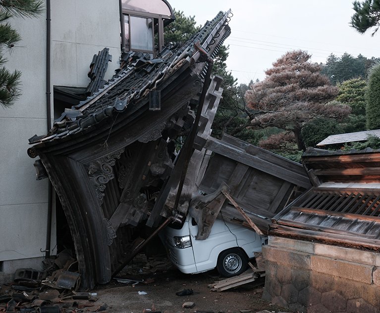 Video from the region showed cracks ripping through streets, collapsed houses and one seven-story building resting on its side after it was tipped over by the quake. Credit: Soichiro Koriyama/Bloomberg