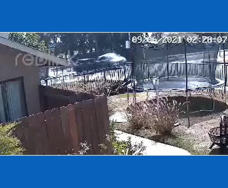 Still shot from the home surveillance video of auto insurance fraudsters in action. Credit: California Department of Insurance.