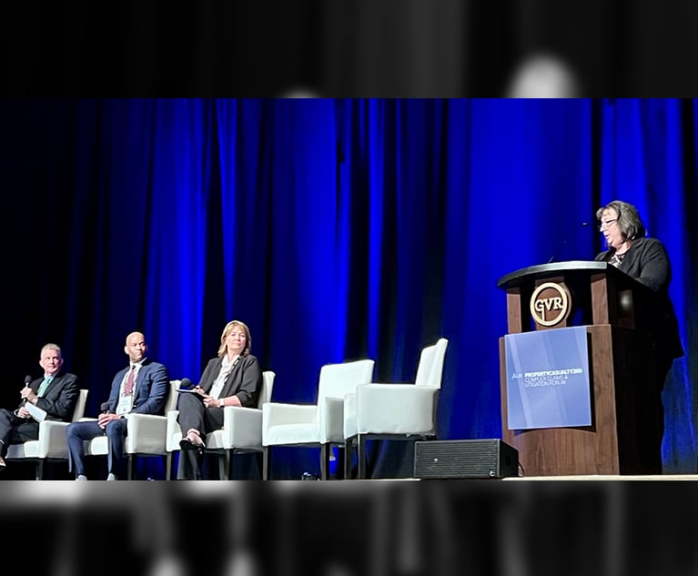 Karen Tucker of Cincinnati Insurance (at podium) moderated a dynamic review of the impact autonomous cars and advanced driver assistance systems might have on future claims. The panelist were (seated left to right) Mike Stankard of Aon; Kenneth Williams of insurance defense firm Segal McCambridge; and Erin Erickson of insurance defense firm Bohyer, Erickson, Beaudette & Tranel. Credit: Matt Jacob