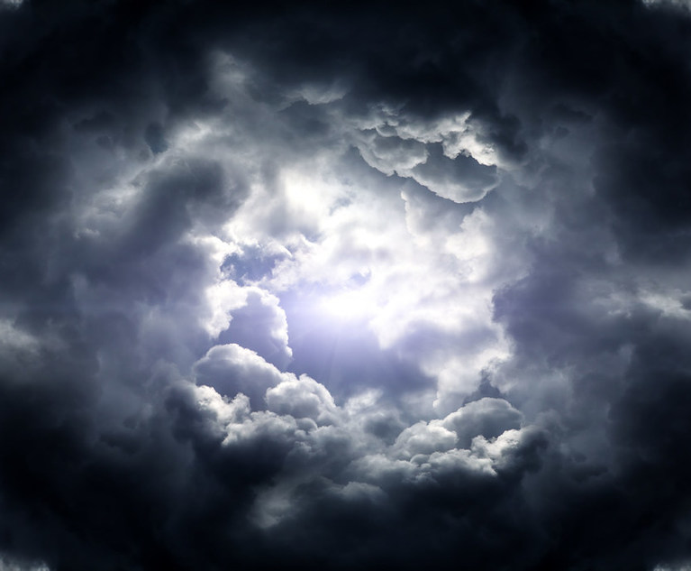 A photo of a circle of dark clouds in the sky