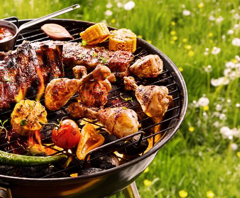 Grease from cooking food on the grill can become a secondary fuel source that sparks a fire. Experts recommend cleaning the grill regularly and cooking away from structures in order to prevent a dangerous flare up. (stockcreations/Shutterstock)