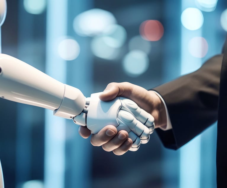 A robot shaking hands with a human.