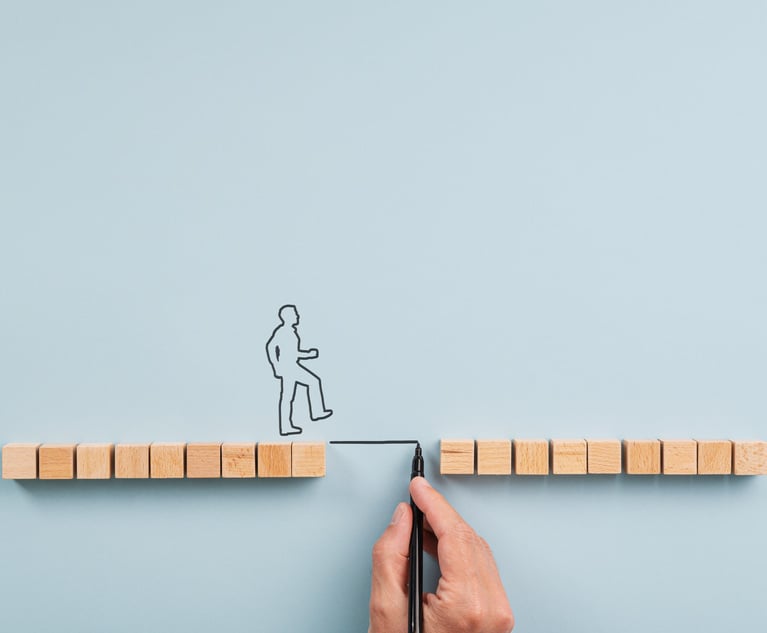 Male hand drawing a bridge between two rows of wooden blocks for a silhouetted man to walk across. Over blue background with plenty of copy space.