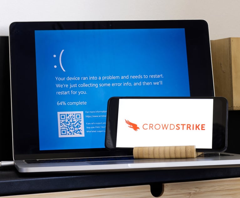 CrowdStrike logo and blue computer screen